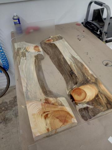 Slabs arranged on acrylic with one end piece up, one down