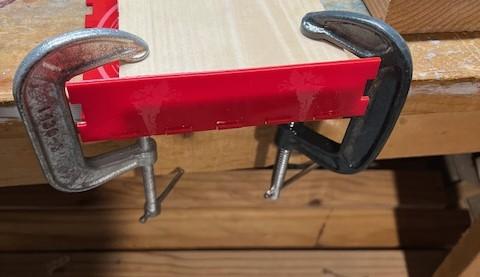 Clamps are helpful when gluing the walls of the tray in place.