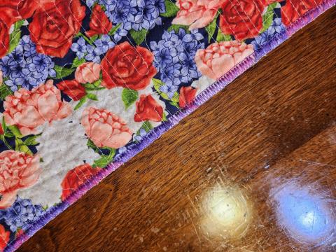 Decorative serged edge. The density could be tighter.