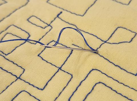 Bury the loose threads into the batting.