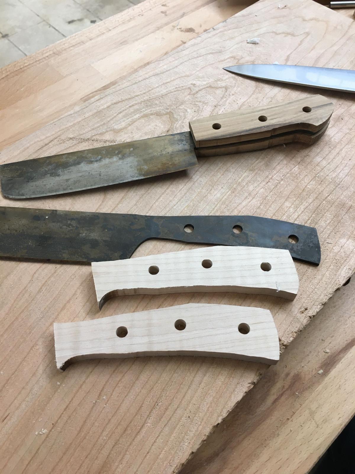 Knife making in progress -- knife parts cut out